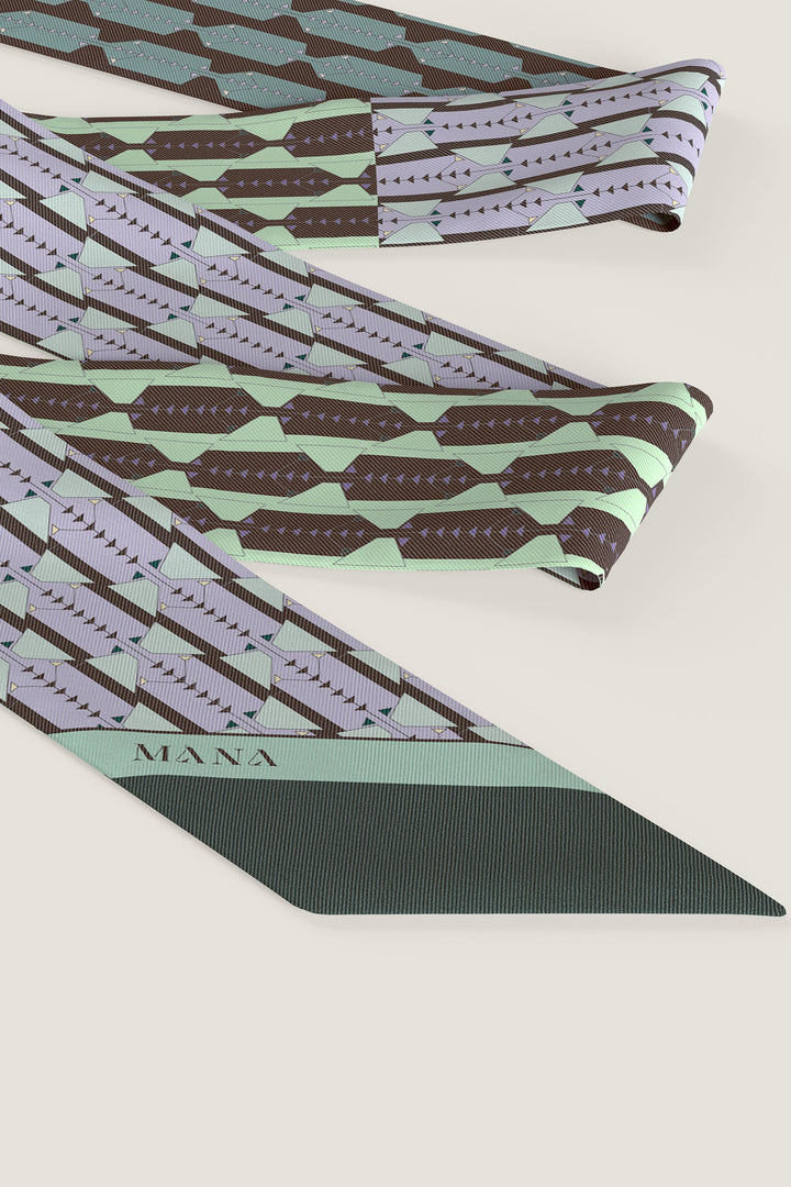 Close-up of Sablier Dore silk twill scarf with lilac and green-accented line design by MÀNA