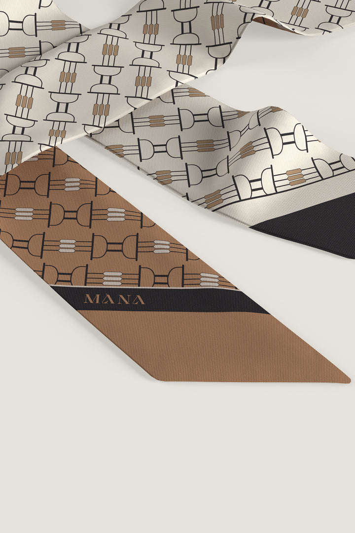 Close up of twilly scarf with elegant Art Deco design in cognac and cream by MÀNA