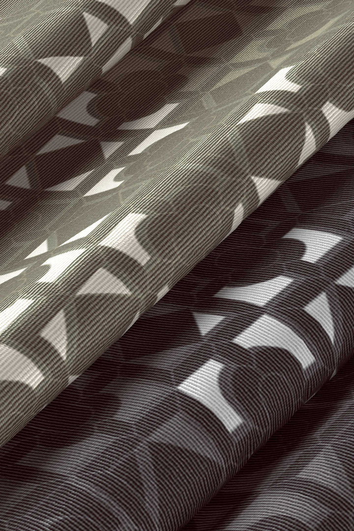 Detail of limited edition silk scarf with layered pattern composition by MÀNA