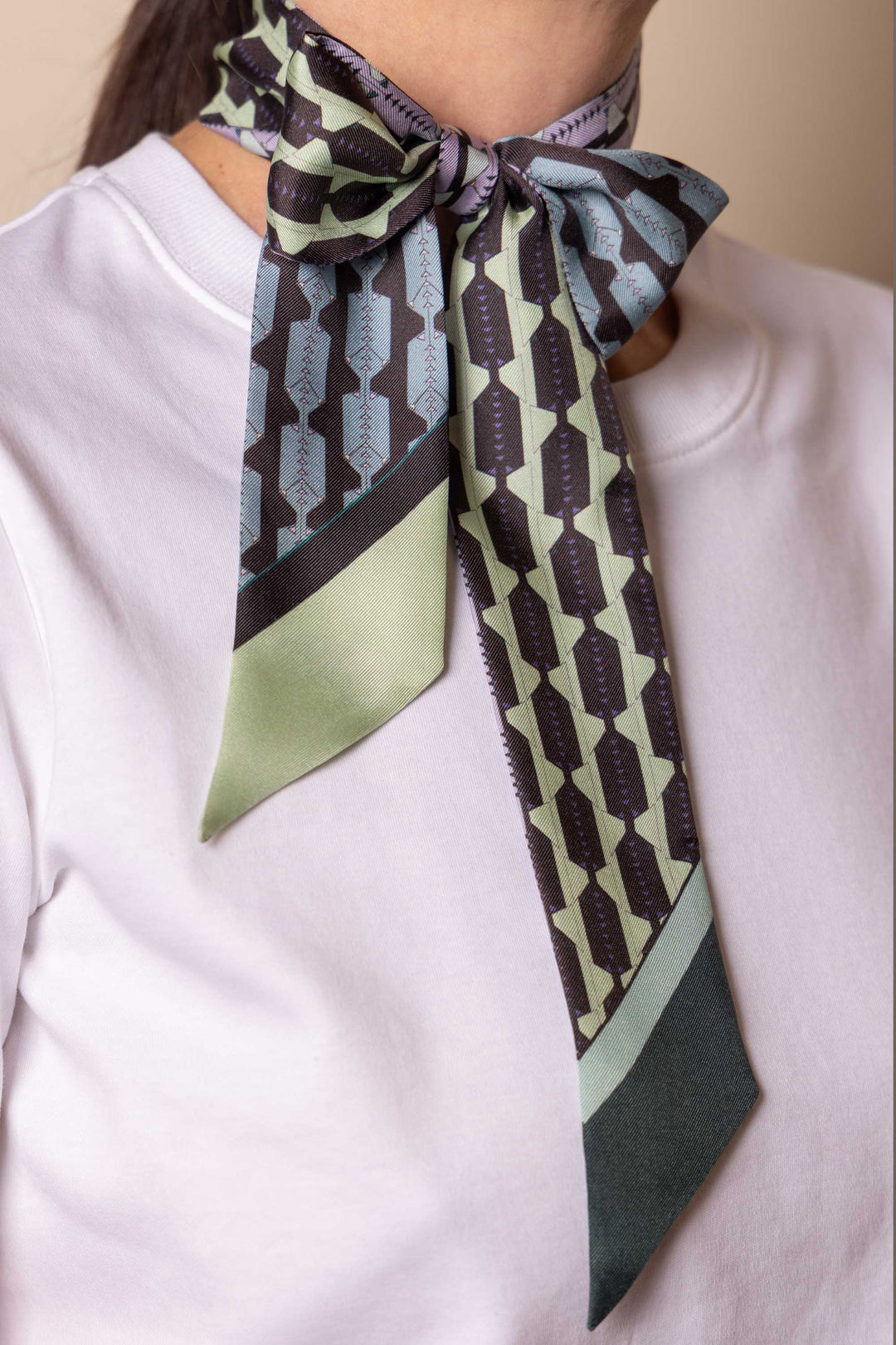 Double-sided luxury silk twill scarf on white t-shirt by MÀNA Amsterdam