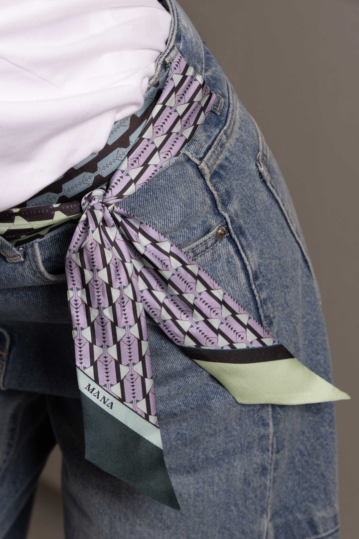 Double-sided luxury silk twill scarf worn as belt on jeans by MÀNA Amsterdam