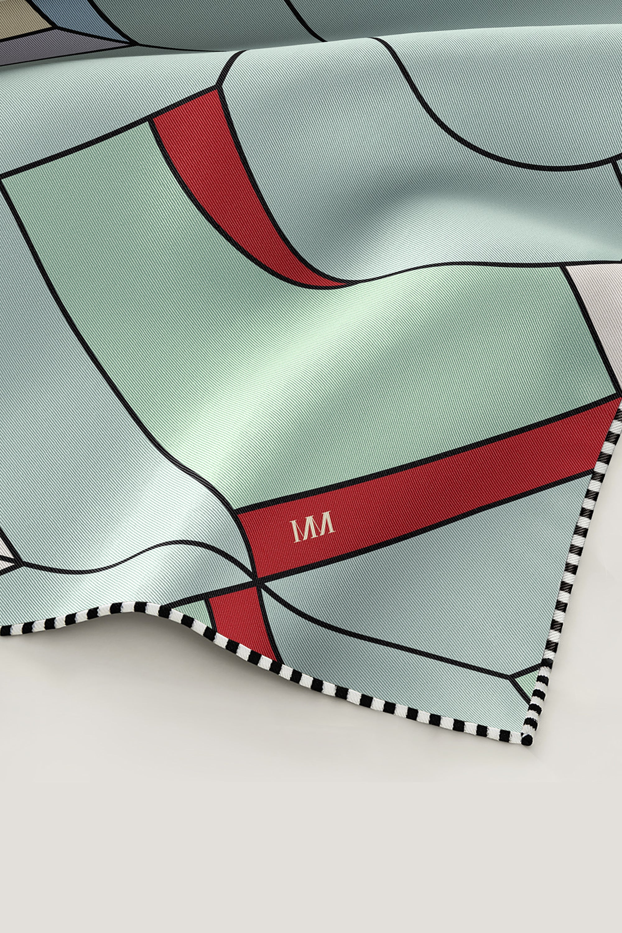 Hand-rolled edge of luxury double faced silk scarf 90 in Art Deco pattern by MÀNA