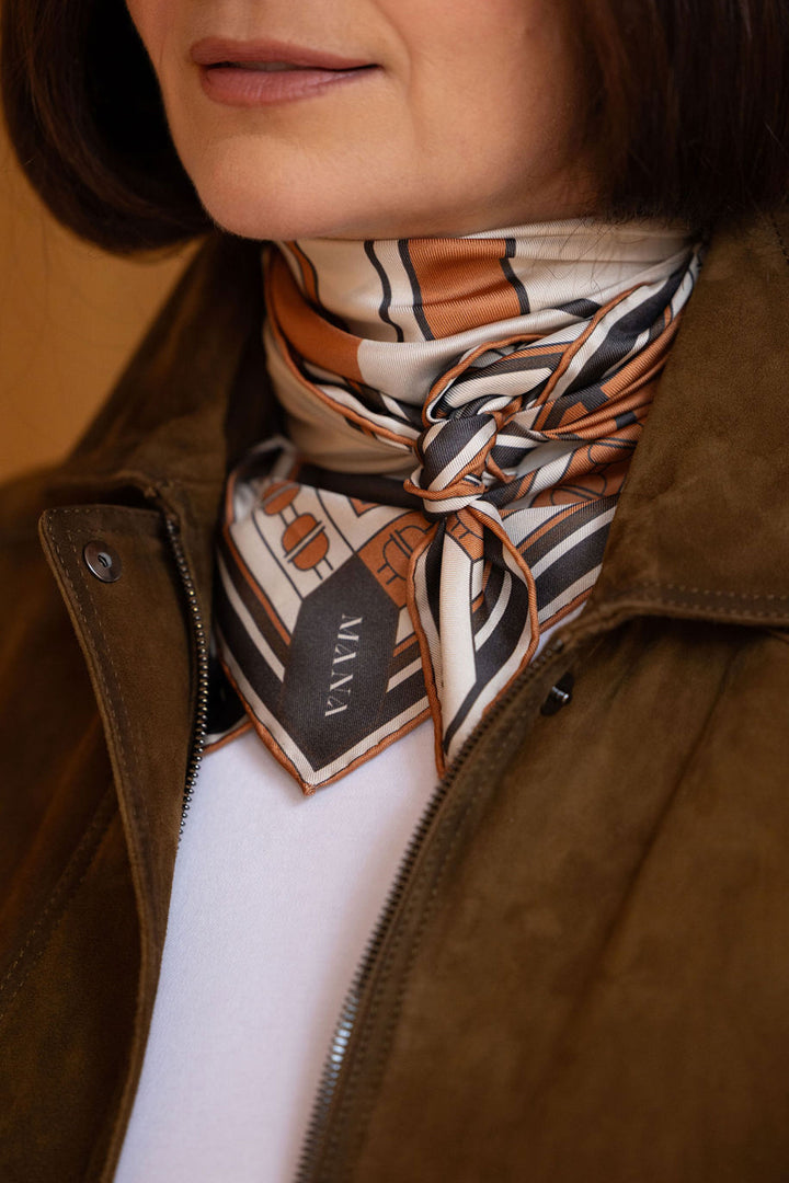Luxury designed silk scarf with hand rolled edges in warm cognac and ivory by MÀNA